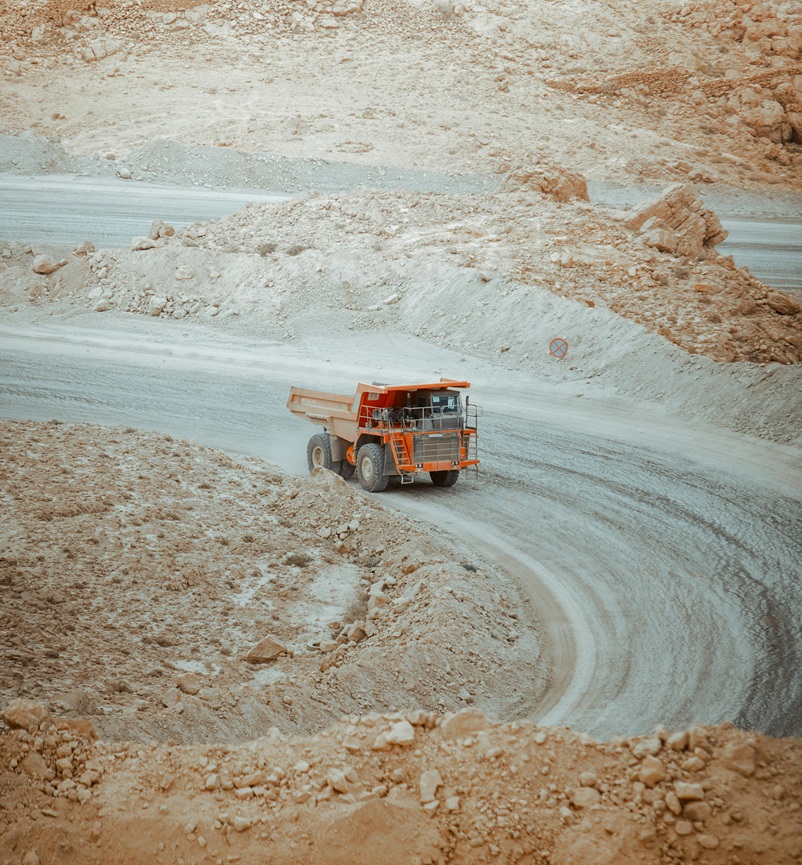 Executive team reviewing mining investment portfolios